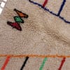 atlas-berber-handwoven-wool-carpet Ivory Moroccan carpet with linear geometric motifs.