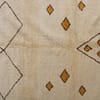 ivory-berber-diamond-moroccan-area-rug Overhead view focusing on the central diamond and triangular pattern layout.