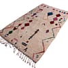 ivory-moroccan-wool-rug-tribal-design Top view of Moroccan wool rug showing geometric tribal patterns and symmetrical design.