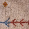ivory-tribal-moroccan-rug-with-diamond-motifs Texture close-up emphasizing thick, soft, high-pile Moroccan wool.
