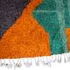 luxury-moroccan-wool-area-rug Side border close-up featuring zigzag tribal line pattern.
