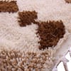 moroccan-diamond-pattern-wool-rug Side angle view highlighting thick wool pile and geometric brown design.