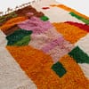 multicolor-moroccan-wool-area-rug Traditional Moroccan wool rug with vibrant tribal motifs close view