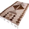 premium-ivory-brown-berber-wool-rug Top view of ivory Moroccan rug showing central diamond and symmetrical tribal motifs.