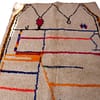 thick-pile-moroccan-berber-rug azilal style rug with multicolor horizontal stripes and fringe.