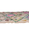 traditional-multicolor-moroccan-wool-rug Partial side view emphasizing the texture, vibrant colors, and traditional Moroccan craftsmanship.