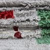 abstract-moroccan-rug-green-red-geometric Slight side perspective of the rug emphasizing the depth and handwoven craftsmanship.