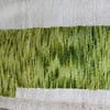 artisan-made-wool-rug-morocco Handmade white Beni Ourain rug with green, brown, and yellow Berber design – complete view.