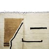 beni-ourain-style-rug-yellow-geometric Angled view of cream Moroccan rug with modern yellow and black design.