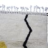 handmade-moroccan-wool-rug-modern-design Angled view of cream Moroccan wool rug with modern yellow and black design.