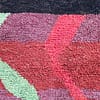 large-moroccan-tribal-rug-red-black Mid-distance view of the rug showing balanced abstract tribal patterns across the surface.