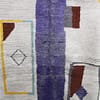 modern-moroccan-carpet-purple-accent Mid-distance view showing balanced abstract shapes in brown, mustard yellow, and lavender tones.