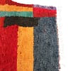 modern-moroccan-geometric-shag-rug Upper left detail featuring orange and green geometric shapes with layered stripes