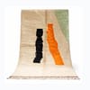 Abstract Moroccan rug details Moroccan Beni Ourain rug centered in the frame with abstract black and orange design
