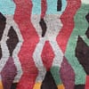 azilal-wool-rug-bohemian-style-home-decor Close-up view of Moroccan Azilal rug showing detailed wool texture and colors
