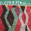 moroccan-azilal-rug-handmade-colorful-abstract-design Close-up detail of rug fringes showing natural wool fibers