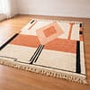 morrocan-wool-rug Modern boho area rug in dusty pink and cream with abstract tribal pattern. in bedroom