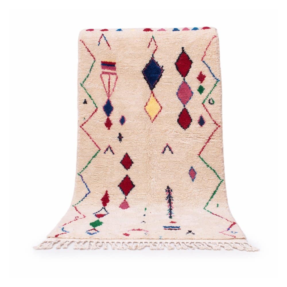 handmade-moroccan-berber-rug-colorful-diamonds Full front view of a handmade Moroccan Berber rug with colorful diamond motifs on an ivory wool base.