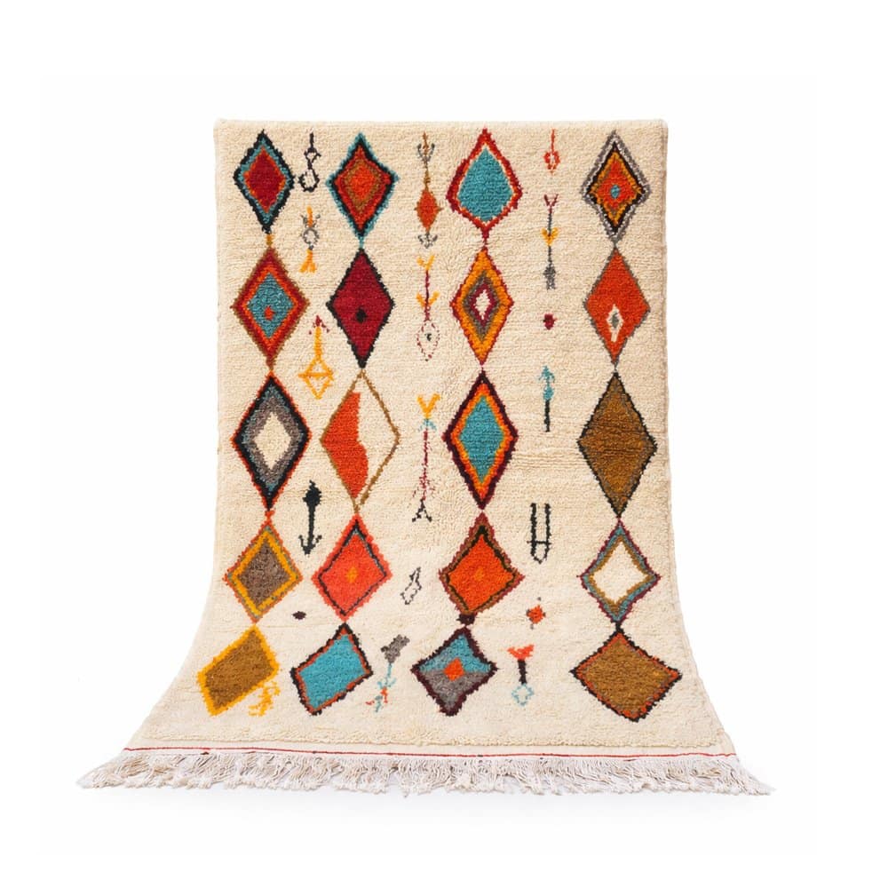 handmade-moroccan-berber-rug-white-background Handmade Moroccan Berber rug with colorful diamond patterns on white background.