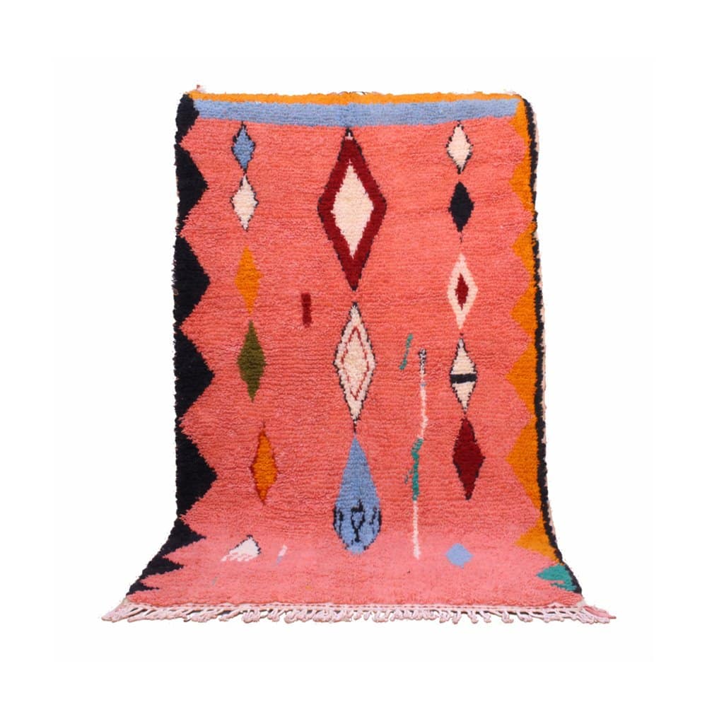 handmade-pink-moroccan-berber-wool-rug Full view of a pink Moroccan Berber rug featuring bold geometric tribal patterns.