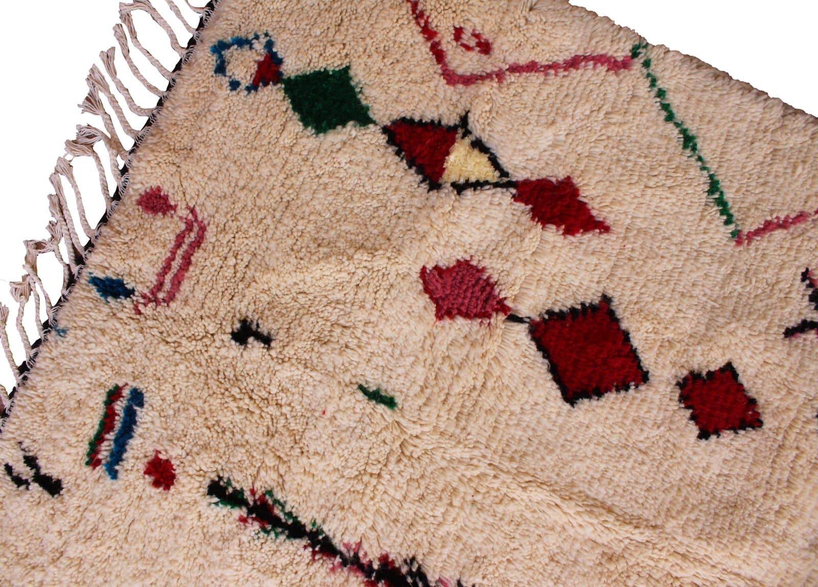 atlas-berber-handwoven-wool-carpet Side angle view of thick Berber rug highlighting its plush wool pile and texture.