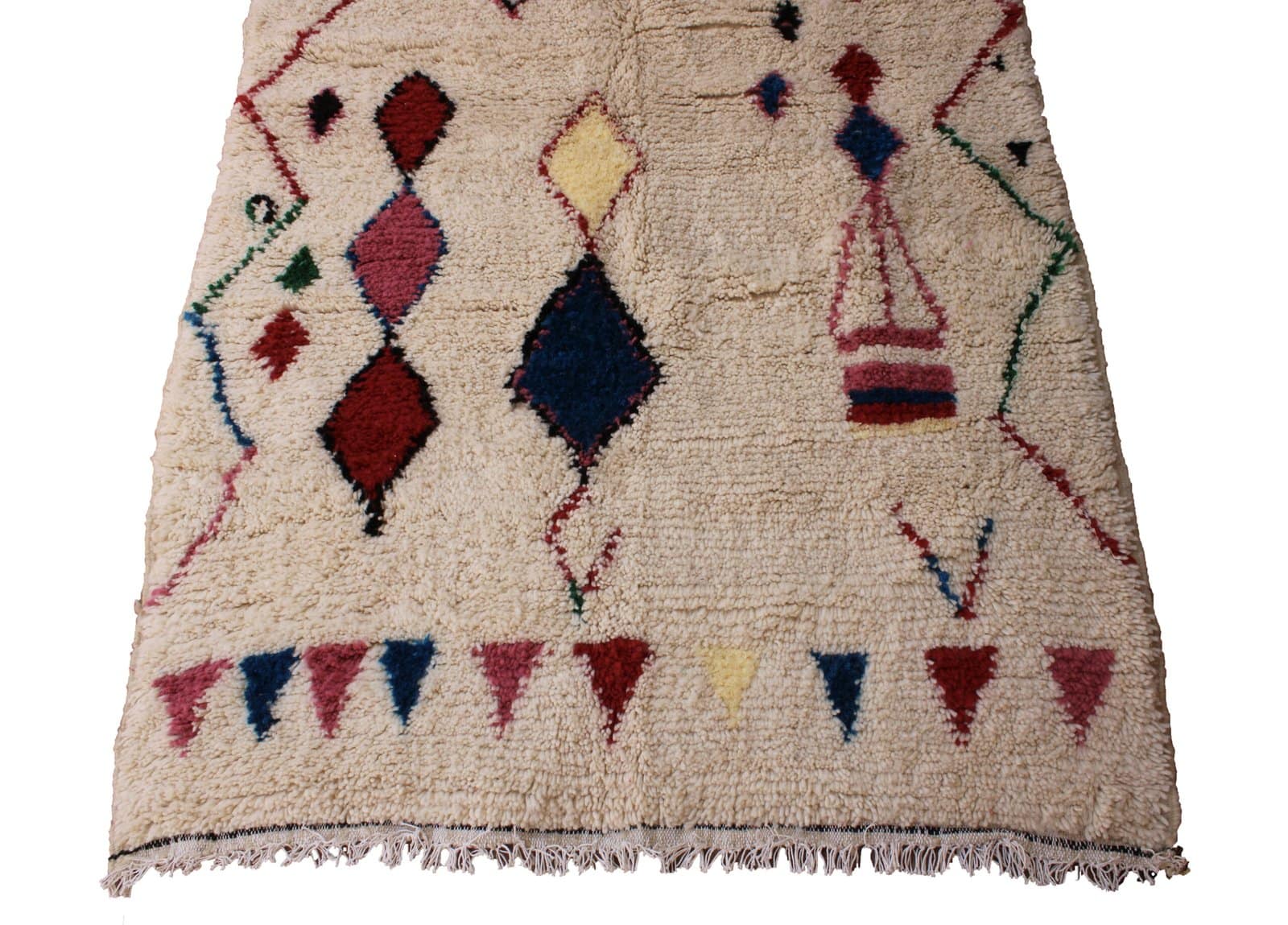 authentic-moroccan-tribal-area-rug Slight angled perspective of Berber rug isolated on white background.