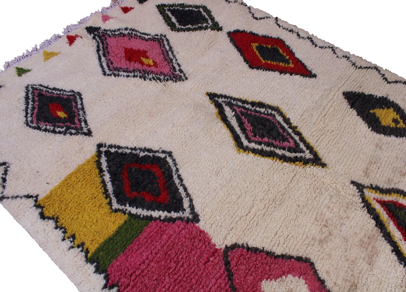 beni-ourain-inspired-multicolor-area-rug Top section close-up showing upper geometric shapes and bright pink border detail