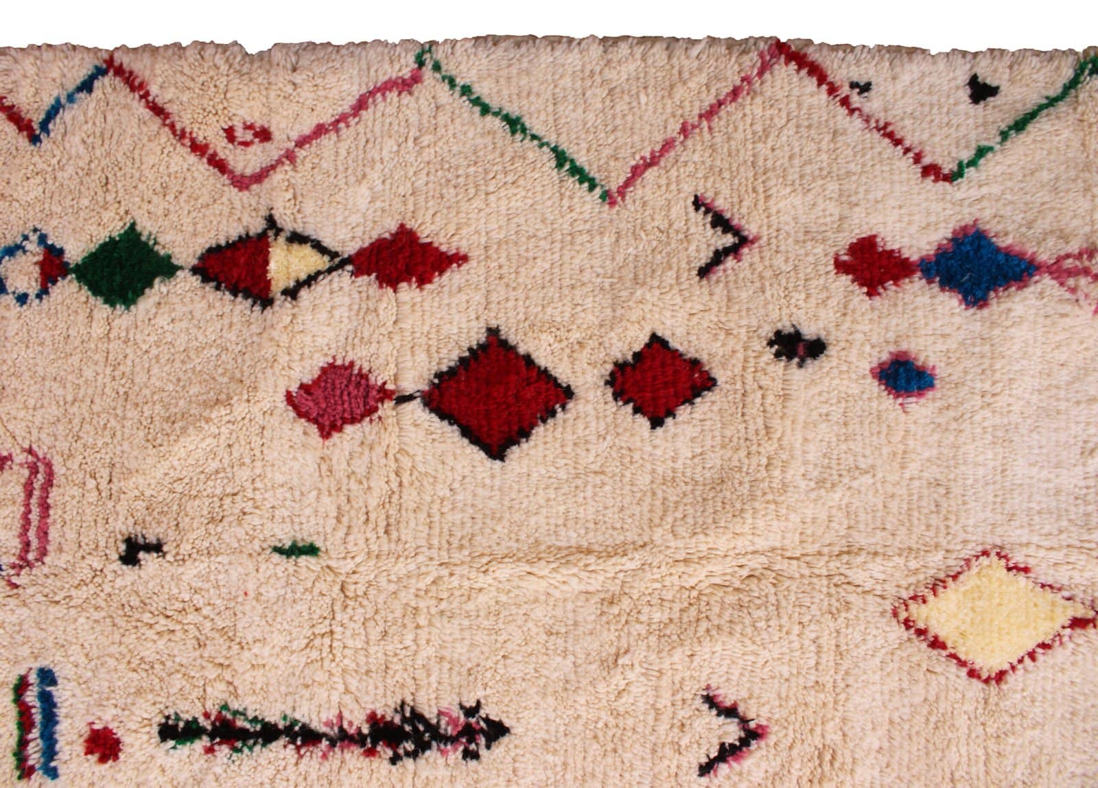 bohemian-moroccan-rug-with-diamond-motifs Full-length vertical display of artisan handmade Moroccan Berber carpet.