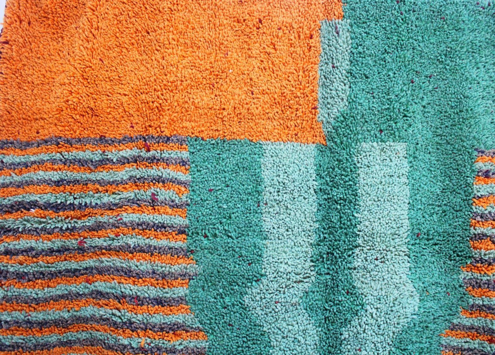 colorful-azilal-style-moroccan-area-rug Lower section view highlighting smaller diamond shapes and colorful triangular border accents.
