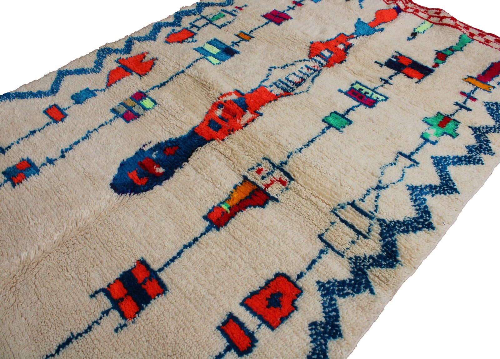 cream-blue-geometric-moroccan-wool-rug Traditional Moroccan rug with red and blue motifs angled view