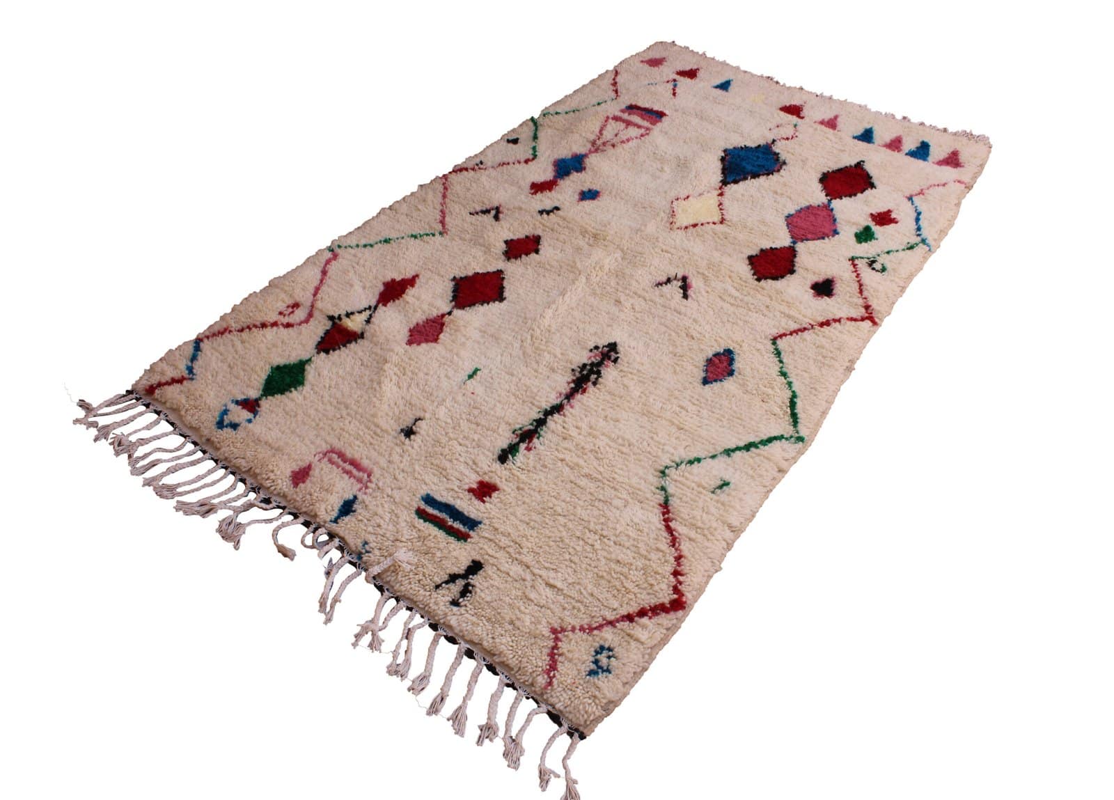 ivory-moroccan-wool-rug-tribal-design Top view of Moroccan wool rug showing geometric tribal patterns and symmetrical design.