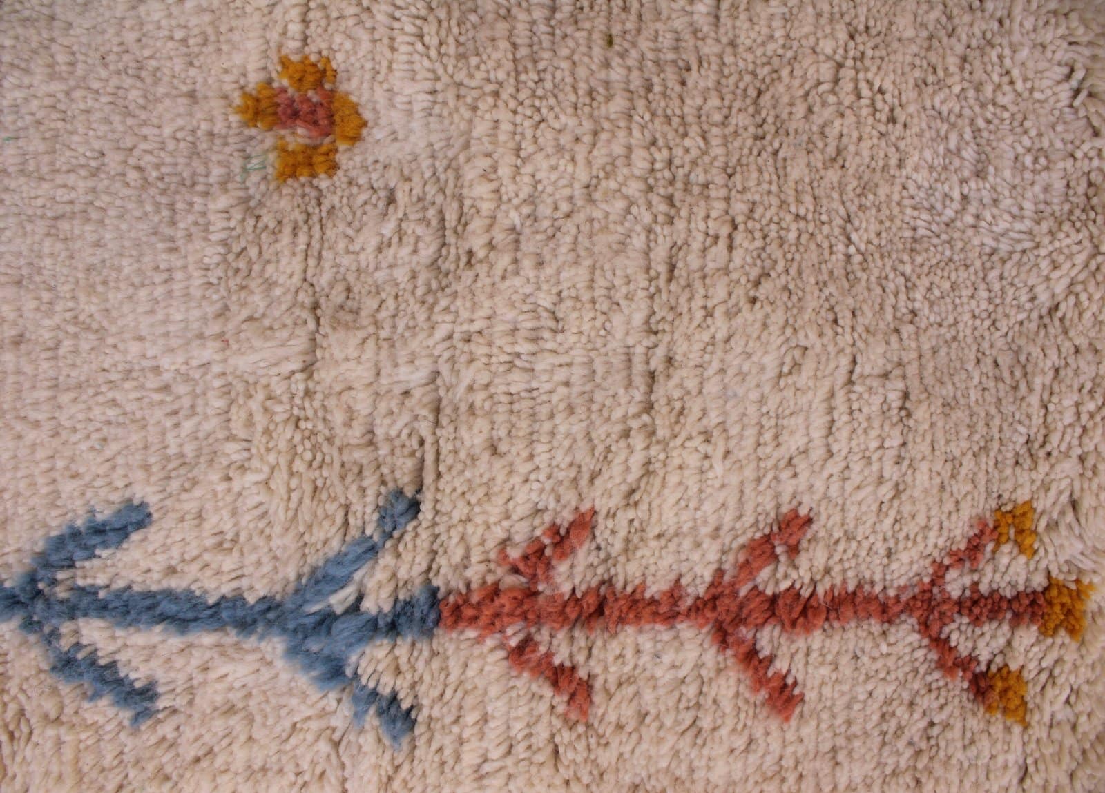 ivory-tribal-moroccan-rug-with-diamond-motifs Texture close-up emphasizing thick, soft, high-pile Moroccan wool.