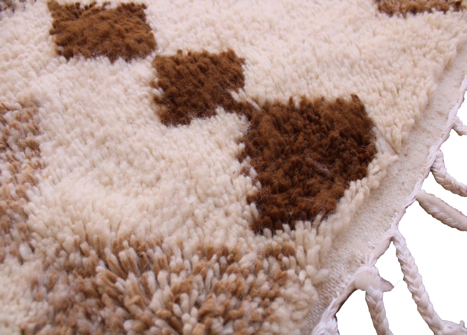 moroccan-diamond-pattern-wool-rug Side angle view highlighting thick wool pile and geometric brown design.