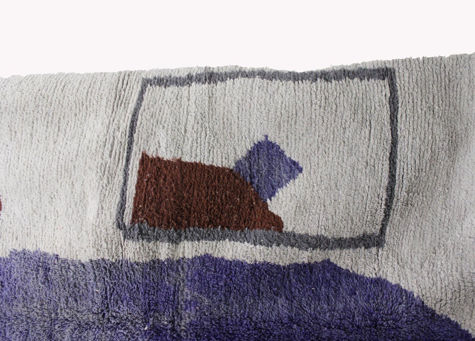 artisan-wool-rug-minimalist-abstract-design Center-focused view of the rug emphasizing the bold purple vertical design in the middle.
