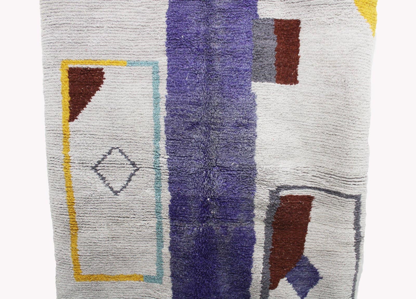 modern-moroccan-carpet-purple-accent Mid-distance view showing balanced abstract shapes in brown, mustard yellow, and lavender tones.