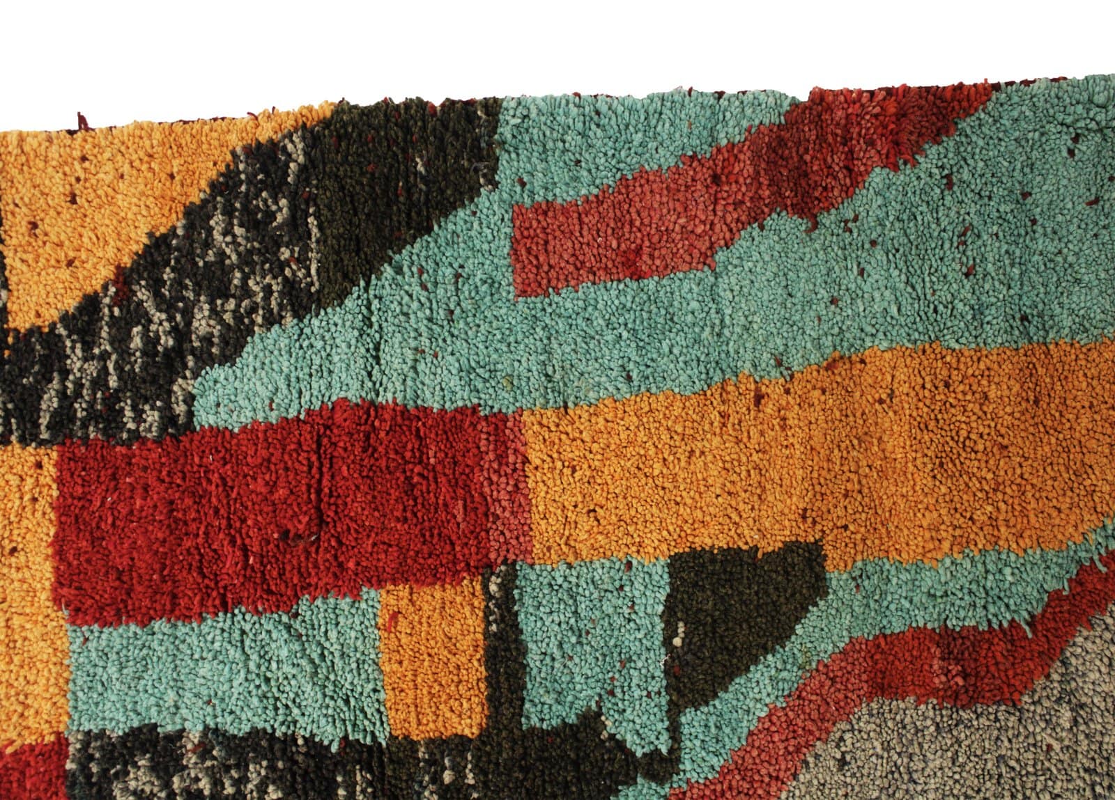 vibrant-berber-tribal-wool-carpet Upper right close-up showing bold black and red abstract lines.
