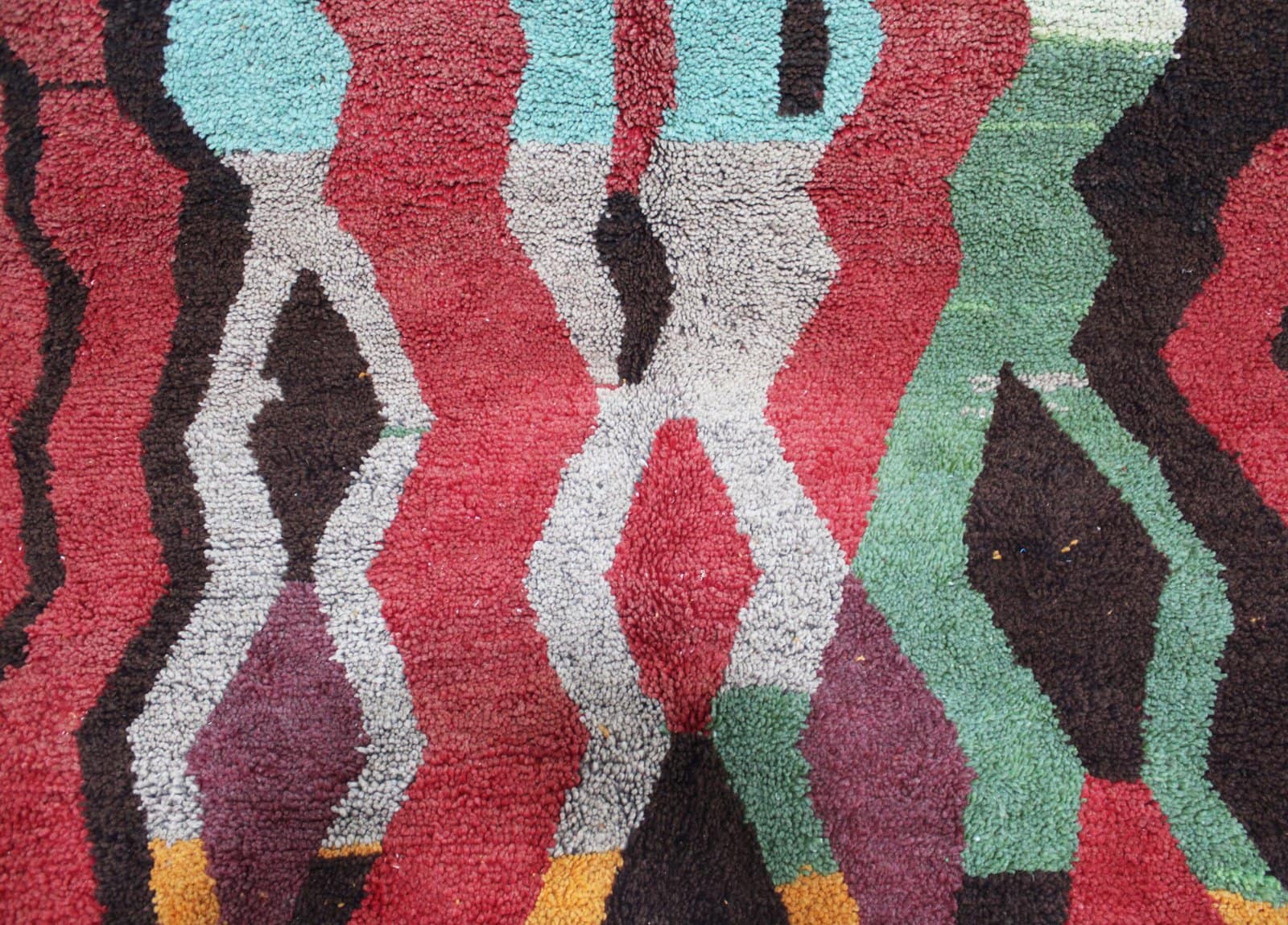 azilal-wool-rug-bohemian-style-home-decor Close-up view of Moroccan Azilal rug showing detailed wool texture and colors