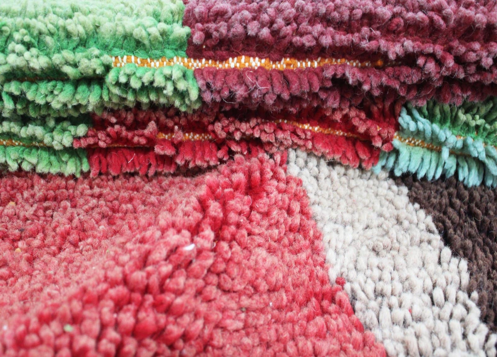 handmade-azilal-rug-berber-pattern-colorful-wool Partial close-up of rug pattern focusing on central shapes