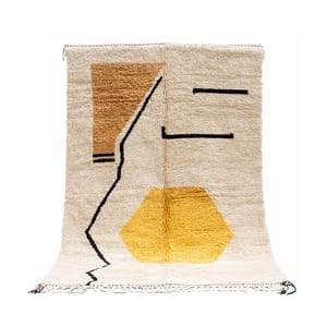 Full view of handmade Moroccan Berber rug with cream base and yellow geometric design.