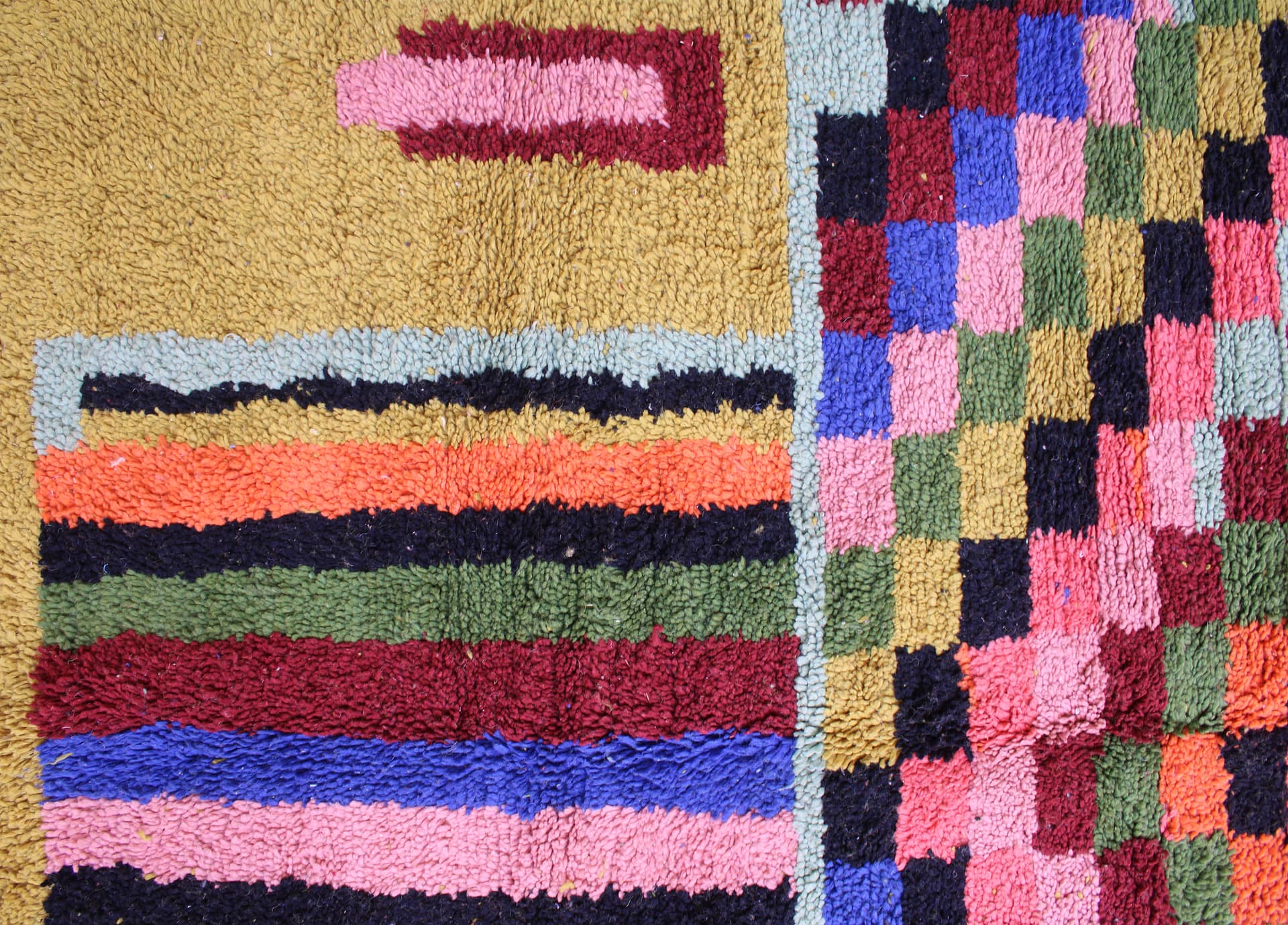 mustard-handwoven-moroccan-carpet Mustard Beni Ourain rug styled in modern interior top view