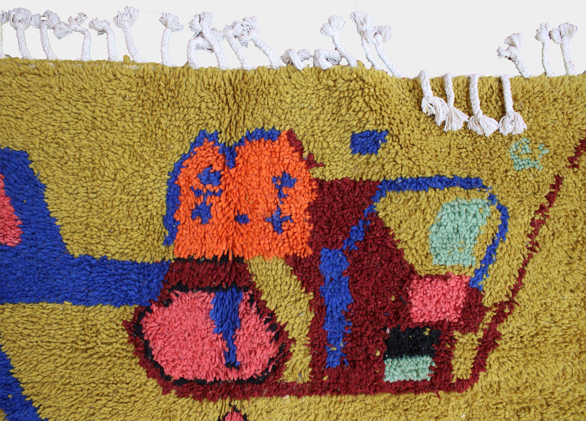 yellow-berber-moroccan-area-rug Warm yellow Moroccan wool rug for boho living room angled view