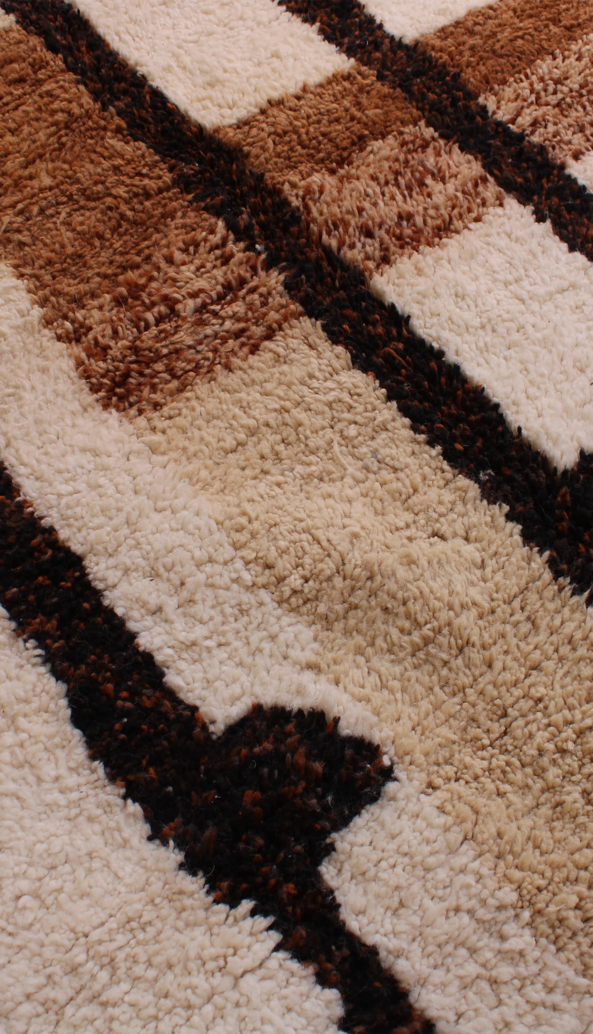 brown-moroccan-beni-ourain-carpet Brown Moroccan Berber rug styled in modern interior angled view angled view